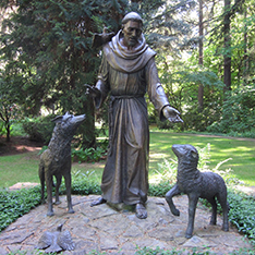 religious saint bronze sculpture Antonio with sheep and wolf